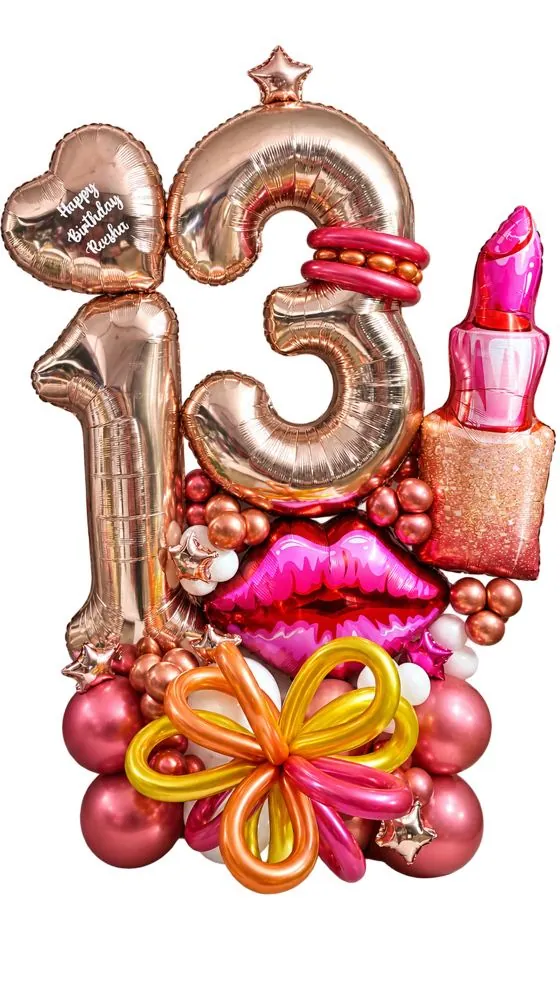 Rose gold number 13 foil balloon stack with a heart, lipstick, lips and a twisted balloon bow